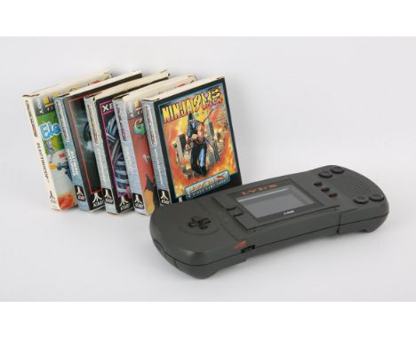 Atari Lynx Handheld + Games. This lot contains an untested Atari Lynx and 5 games. This item also comes with its original pow