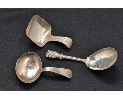 A George III caddy spoon, by John Turner, Birmingham 1801, engraved shield design to bowl; a George III caddy spoon, by Cocks
