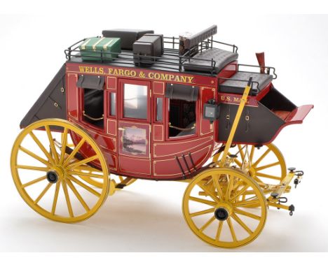 A scratch built model of a Wells. Fargo & Co. 1866 stage coach, 1:8 scale, hand-painted and transfers, with luggage and rifle