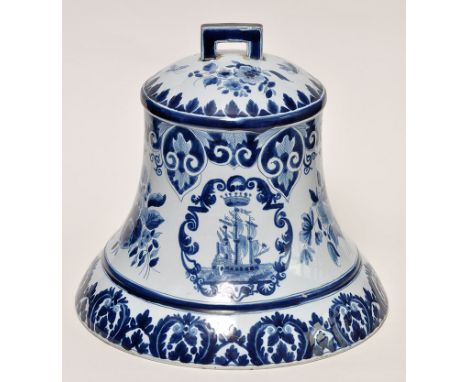 18th Century style Delftware bell, the sides painted with flowers and pendants, height 24cms, "PS", "1702" marks.