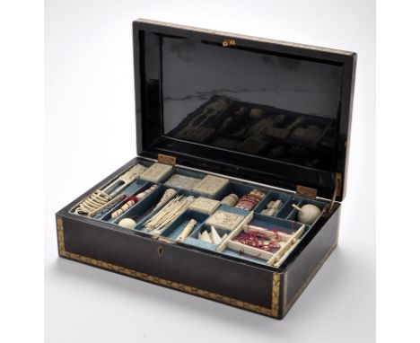 Boxed set of Chinese carved ivory puzzles, to include: ball in a cup; puzzle boxes; pierced barrel; stick puzzles; etc., cont