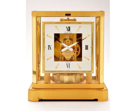 Jaeger LeCoultre: an Atmos clock, with square roman and baton dial within a canted rectangular brass case, numbered 538228, w