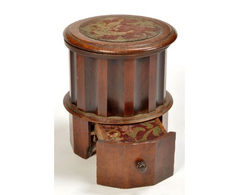 An early 19th Century circular bedside pedestal commode, the carpeted top opening to reveal cut-out well below, surrounded by