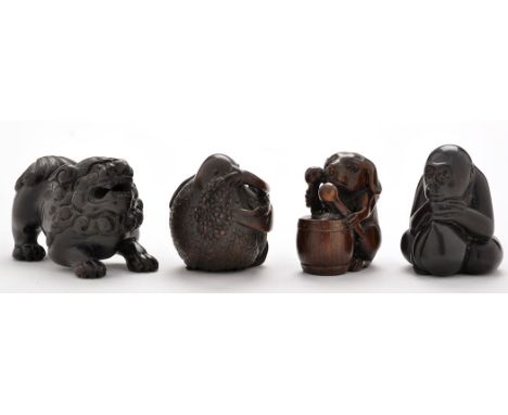 Four Japanese hardwood netsuke, comprising: crouching monkey, with inset signature to base, height 4.2cms; lion dog, with ins