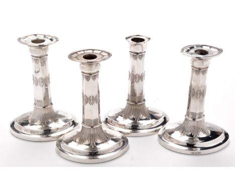 Four Victorian candlesticks, by Harrison Bros. & Howson (George Howson), Sheffield 1900-01, (one without drip pan), in the cl