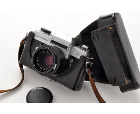 A Leicaflex SL reflex camera, serial no. 1275089, in chrome, fitted a Summicron 50mm f2 lens; in black leather E.R. case.