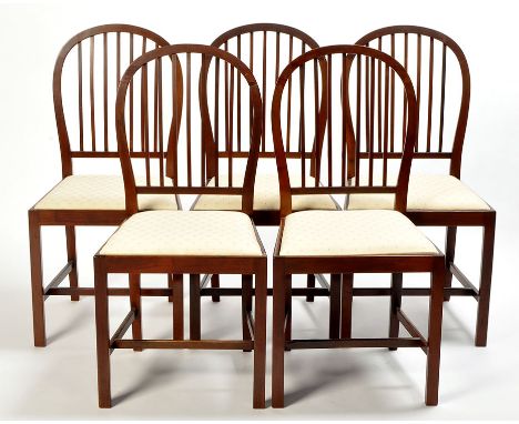 A set of six late George III style mahogany dining chairs, each with curved cresting rail above pierced and square square sti