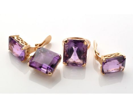 A suite of amethyst jewellery, the scissor cut amethysts set in ring, pendant and earrings, all with openwork scale design mo