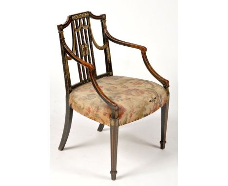 An early 19th Century painted beech elbow chair, the shaped cresting rail above swag and stick splat back painted with an urn