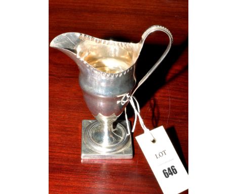 A George III cream jug, possibly by Alexander Field, London 1789, helmet-shaped, crimped border, loop handle, 6in. (15cms), 4