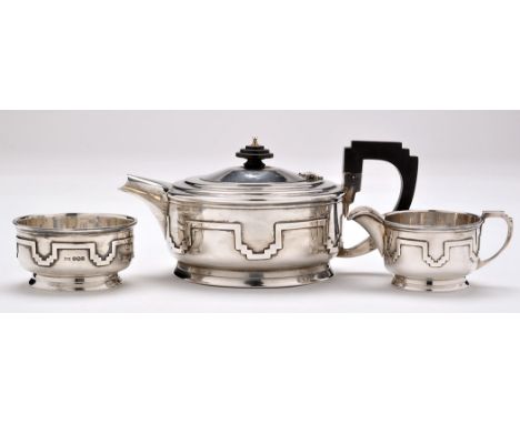 A George VI three-piece tea service, by Walker & Hall, Sheffield 1937, each piece of shaped circular form with Art Deco desig
