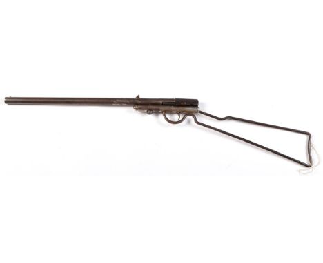 A Quackenbush Junior safety rifle, with .22cal. 18in. barrel and swing breech on tubular mount with wirework stock, 33in. lon