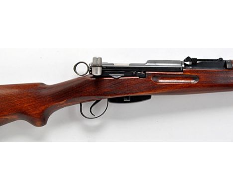 A Swiss Schmidt-Rubin type K31 7.5mm x 55 rifle, with full-length stained beech stock and 24in. barrel, with magazine and spr