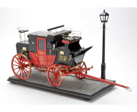 A scratch built model of an 1827 Royal Mail coach, 1:8 scale, each piece hand-made, including a lined buttoned back interior 