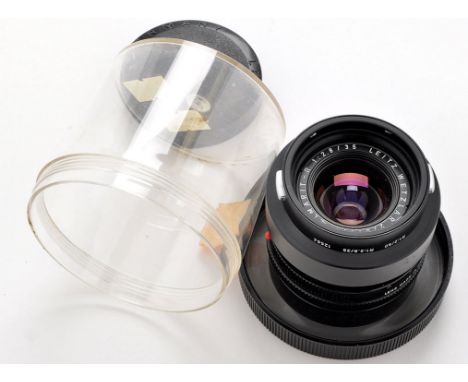 A Leitz Elmarit-R 35mm f2.8 lens and detachable hood.
