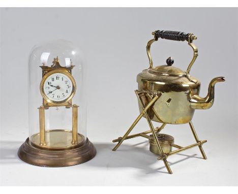 Domed-glass clock (height:29cm), and a brass teapot with stand (2) 