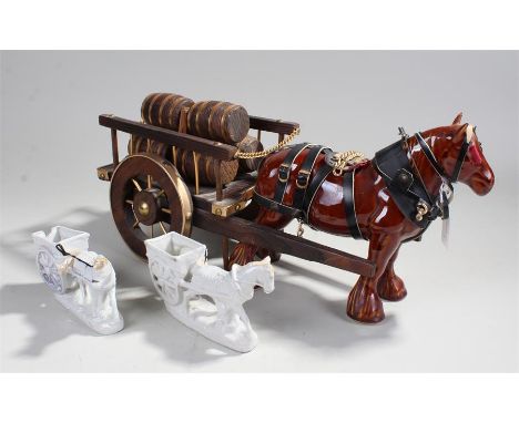 Large model of a horse carrying a cart of barrels, along with two smaller ceramic horse and carts 