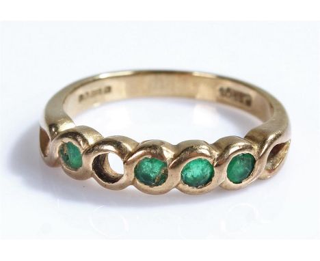 9 carat gold emerald ring, with four emeralds to the head, one stone missing, ring size M