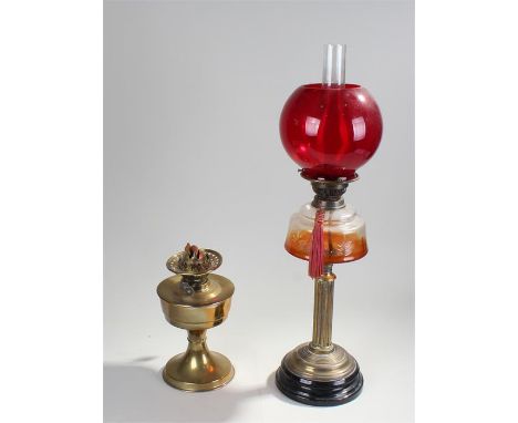 One large oil lamp with red glass bowl (height:71cm), and another oil lamp base (2) 