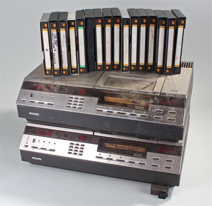 Two Philips VR2022 Video 2000 VCR and a box of cassettes