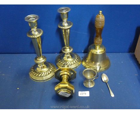 A pair of Victorian brass Candlesticks, brass door Knocker, a plated egg cup and spoon and a 1920's brass bell.