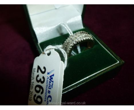 A Buckle ring set with a multitude of baguettes and brilliants.