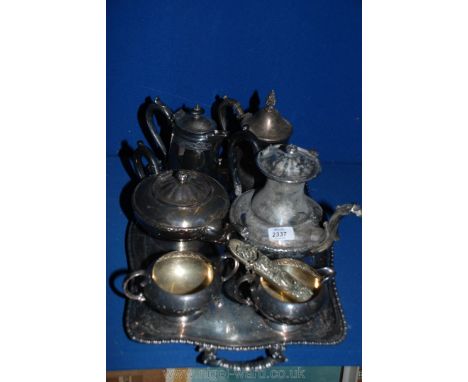 A silver plated tea service and tray, a silver plated water jug and a teapot.