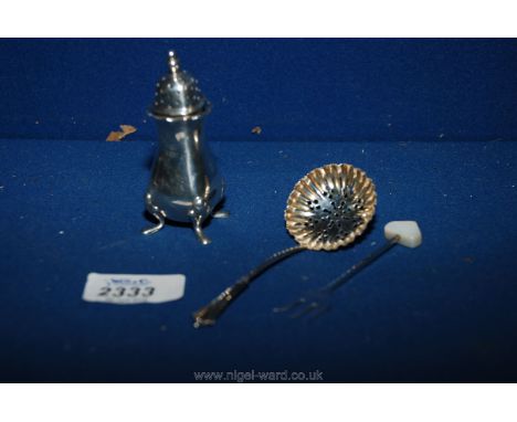 A silver baluster shape pepper pot with pad feet, hallmarked Birmingham 1956 3" tall plus a silver pickle fork with mother of