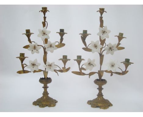 A pair of 19th Century French gilt metal lily spray five light mantel candelabra with opaline glass flowerheads, on spreading