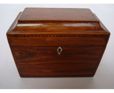 A Regency Kingwood sarcophagus form tea caddy, box wood and ebony strung with Tunbridge ware style micro banding, the hinged 