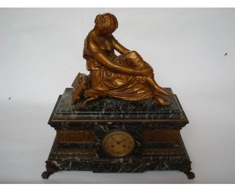 A late 19th Century architectural marble and gilt bronze mantle clock, the sarcophagus form base with central circular engine