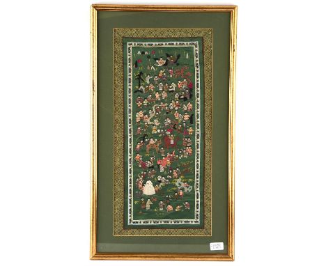 A Chinese textile depicting a large number of Children, framed and glazed, overall dimensions including frame 72 x 41cm; two 