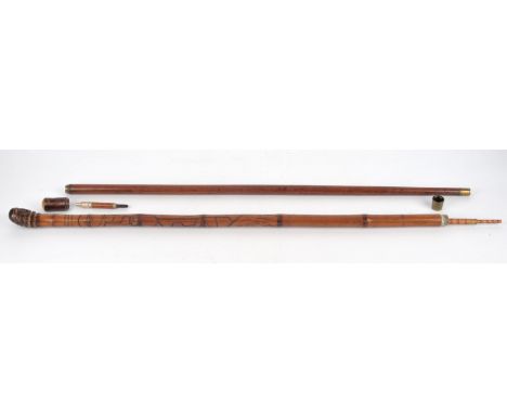 A Japanese bamboo novelty anglers walking stick, the shaft enclosing a telescopic fishing rod, carved with figures, birds and