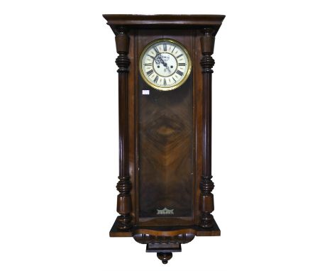 Austrian or German walnut regulator, the dial with Roman numeral chapter ring and seconds subsidiary dial, with two brass wei