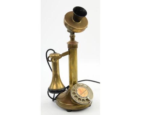 An early 20th century brass 'candlestick' telephone, adapted for use, with bakelite fittings, top adjustable, H approx. 33cm