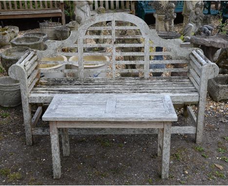 A teak garden bench, after a design by Lutyens, 103cm high x 168cm wide x 55.5cm deep, together with a rectangular table, 50c