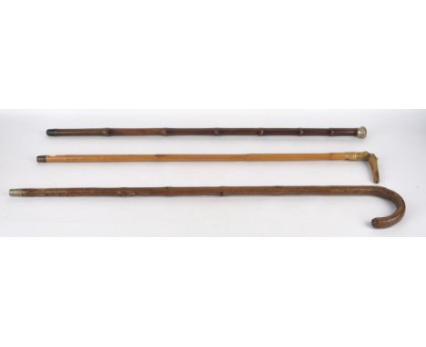 A late 19th century horse measuring walking stick, the hickory shaft enclosing a silver mounted brass measuring implement, de