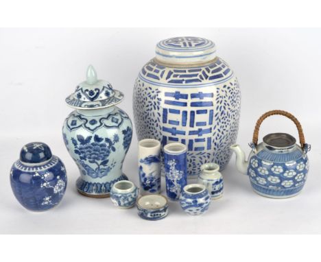 Ten pieces of blue and white, including: two bird feeders, Qing Dynasty or later; a ginger jar; a teapot; two small brush pot