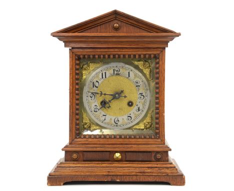 An Edwardian oak cased bracket clock, the 13cm dial with a steel chapter ring and brass spandrels, the twin train movement st