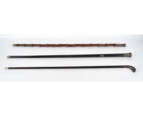 A late 19th century, white metal mounted Sunday stick with hickory shaft, 90cm, a late 19th century bamboo walking can with h