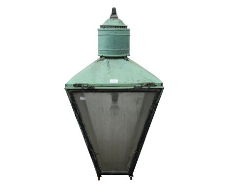 An early 20th century copper lantern with verdigree patination over a tapering square body with inset glazed panels.  Fitting