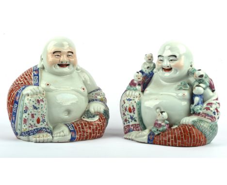 Two famille rose figures of Budai He Shang, the Monk of Chan Buddhism, identified with Maitreya. One figure with a rosary in 