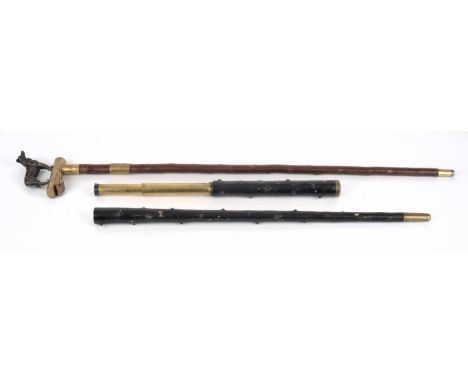 A late 19th century novelty 'telescope' walking stick.  The ebonised blackthorn body enclosing a two drawer brass telescope, 