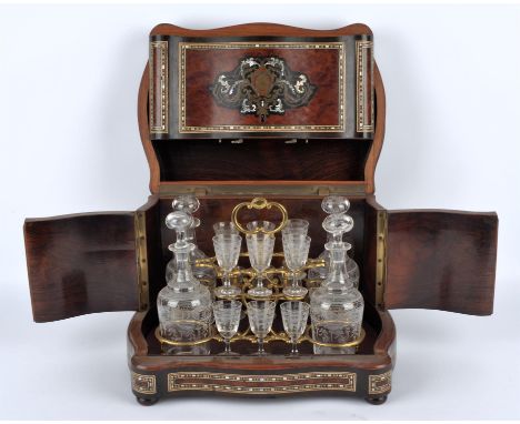 A Napoleon III amboyna decanter cabinet, with inset brass and mother of pearl decoration, the interior with a decanter and gl
