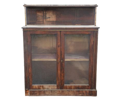 A Regency rosewood side cabinet, inlaid with brass stringing and mounts, the splashback with galleried shelf and brass column