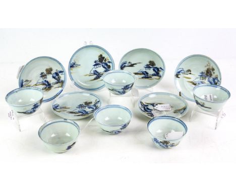 Six Chinese Nanking Cargo blue and white tea bowls and saucers, 18th Century, decorated with landscapes, lot stickers to base
