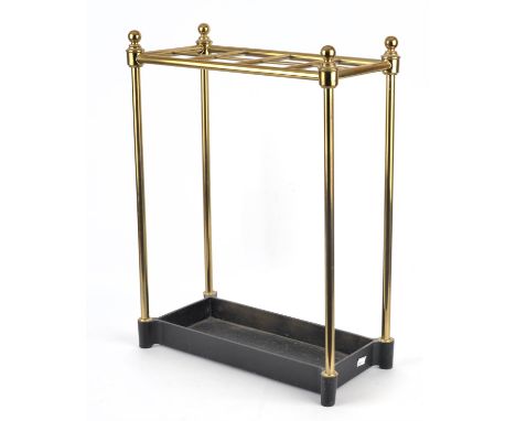 A Victorian style, eight division brass stick stand of tubular form over an ebonised cast iron base, 61.5cm high, 46cm high, 