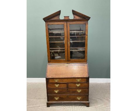 GEORGIAN PERIOD OAK BUREAU BOOKCASEcirca 1800, having a broken architectural pediment over twin glazed doors and interior adj