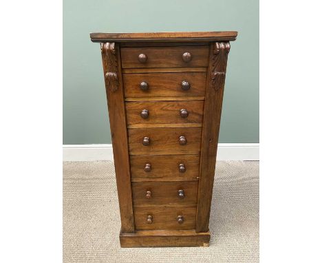 VICTORIAN MAHOGANY WELLINGTON CHEST OF SEVEN OPENING DRAWERS, with carved corbel upper detail on a plinth base, the drawer fr