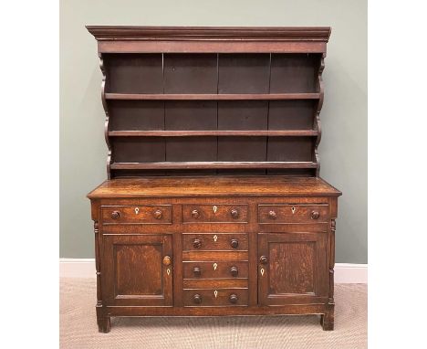 GOOD NORTH WALES OAK DRESSER circa 1850, wide backboards to a three-shelf upper rack, having shaped detail to the sides, the 